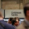 Traders work on the floor of the New York Stock Exchange near the Goldman Sachs stall